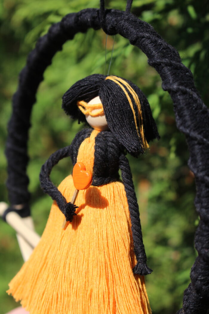 macrame doll black orange